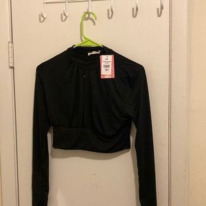 Black long sleeve crop top with peekaboo slit